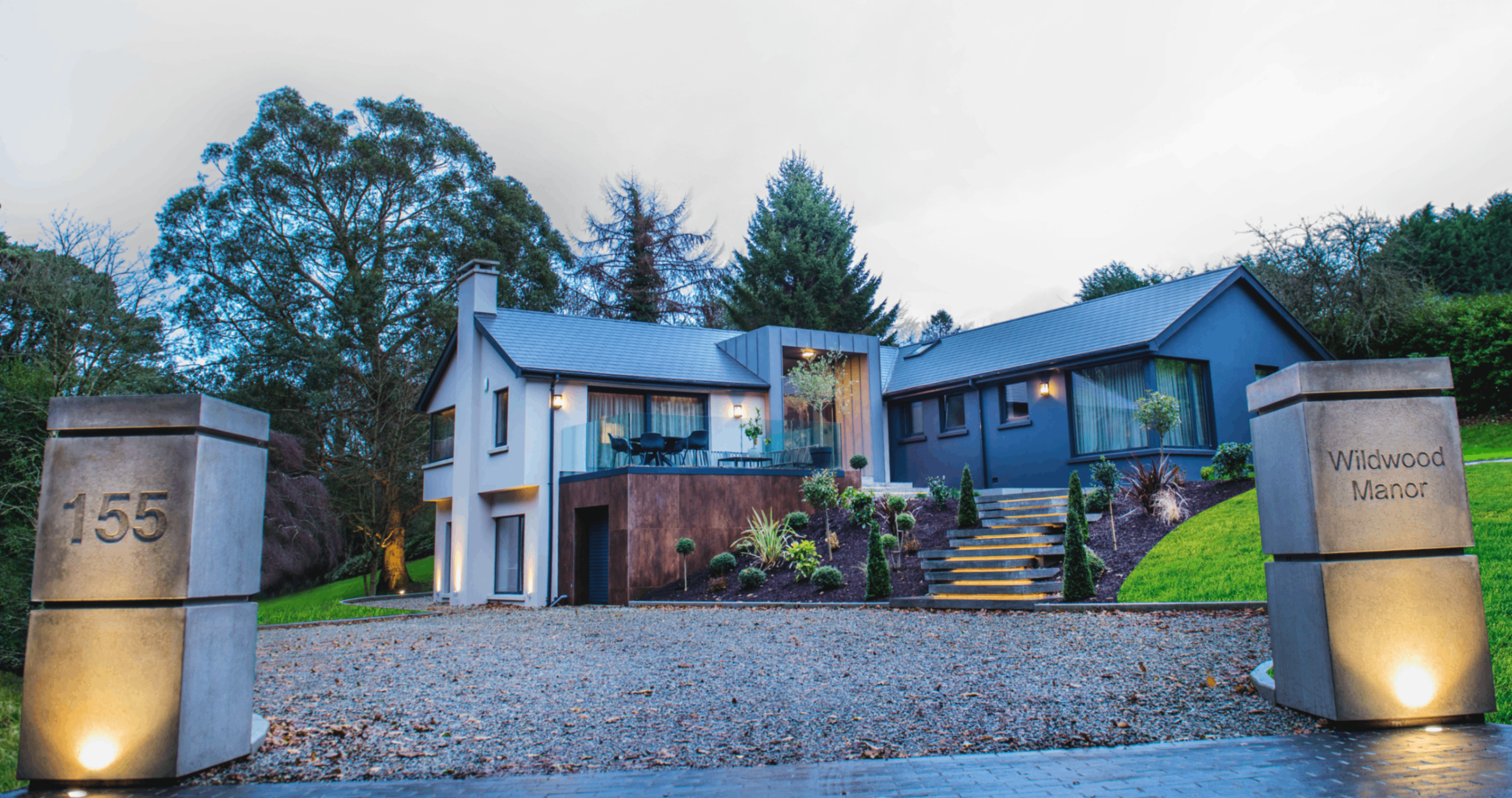 Cultra House with Bespoke concrete pillars with house number and name imprinted and floating concrete steps